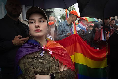 Woman soldier attends a Pride march